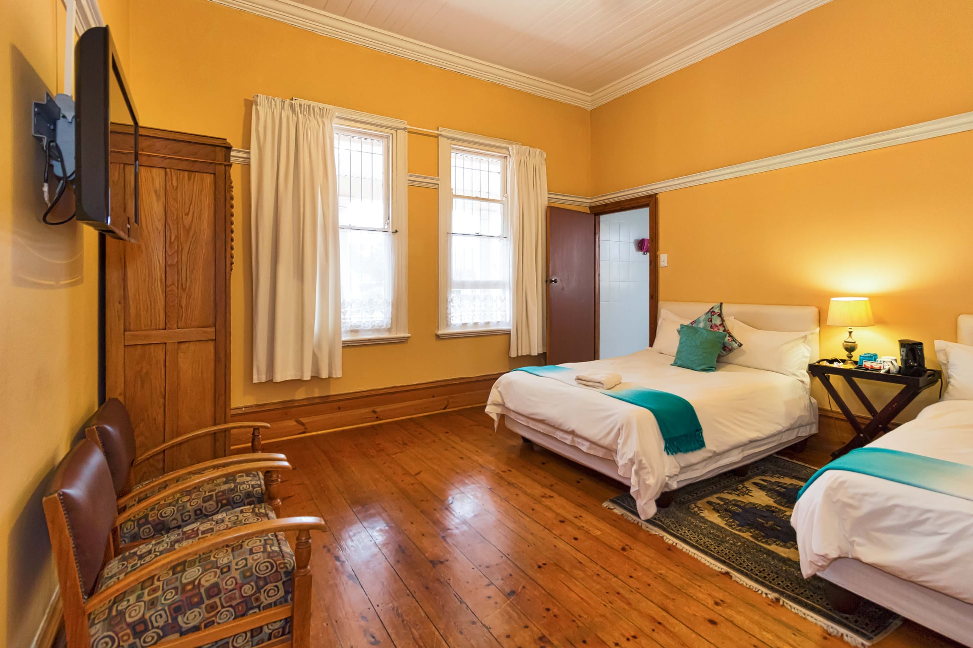 Spring Fresh Suite with Victorian fireplace and teal accents