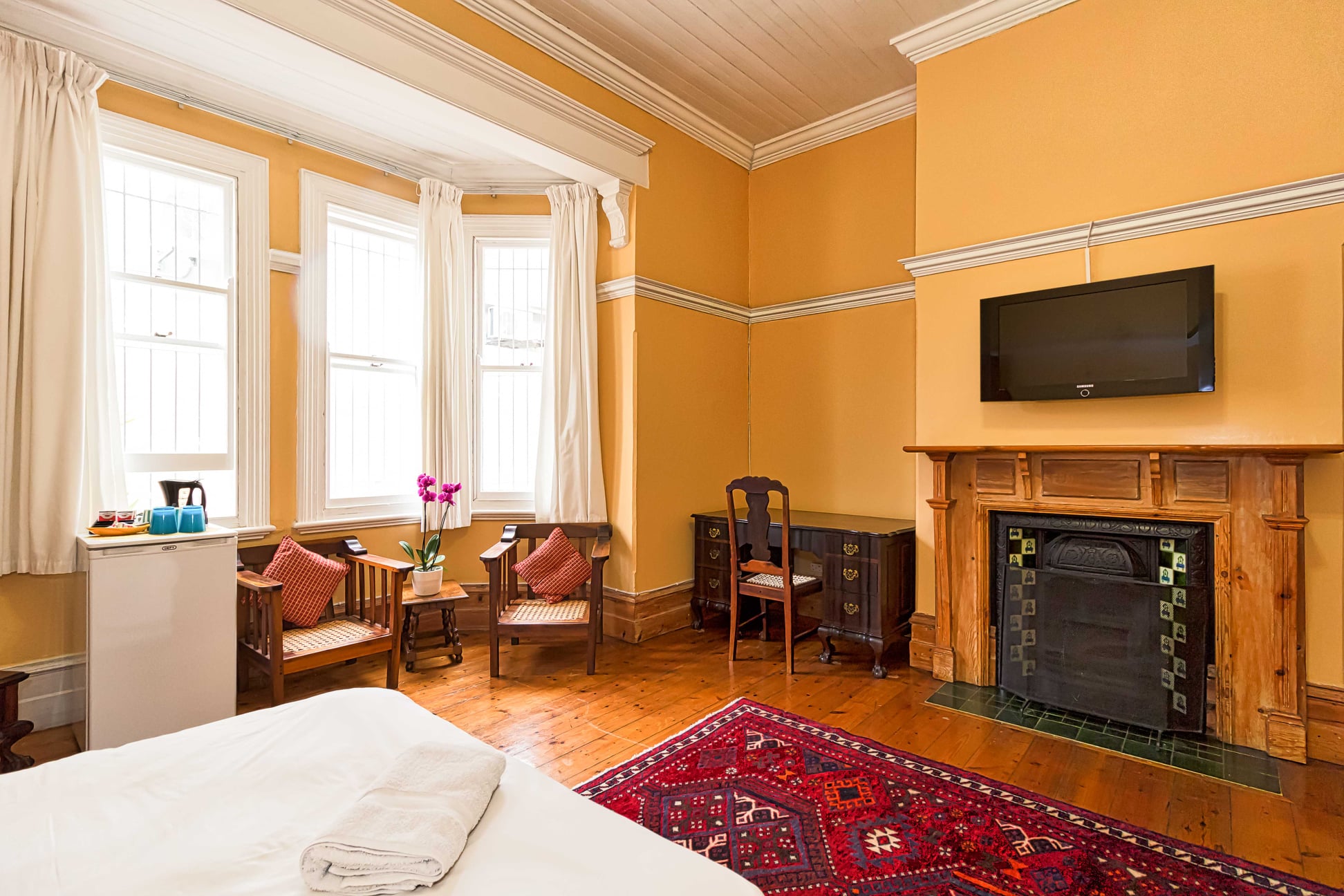 Elegant bedroom with original Victorian fireplace